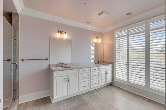 full bath with visible vents, ornamental molding, a stall shower, and a sink