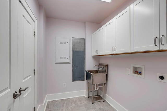 washroom featuring baseboards, washer hookup, electric panel, cabinet space, and hookup for an electric dryer