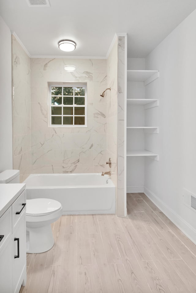 full bath with toilet, wood finished floors, visible vents, vanity, and bathing tub / shower combination