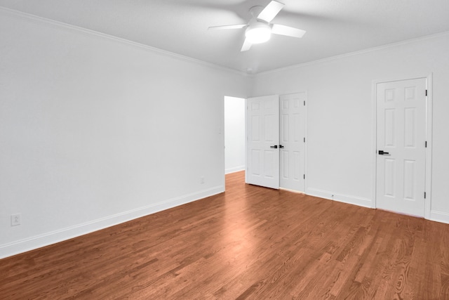 unfurnished bedroom featuring ceiling fan, ornamental molding, wood finished floors, and baseboards