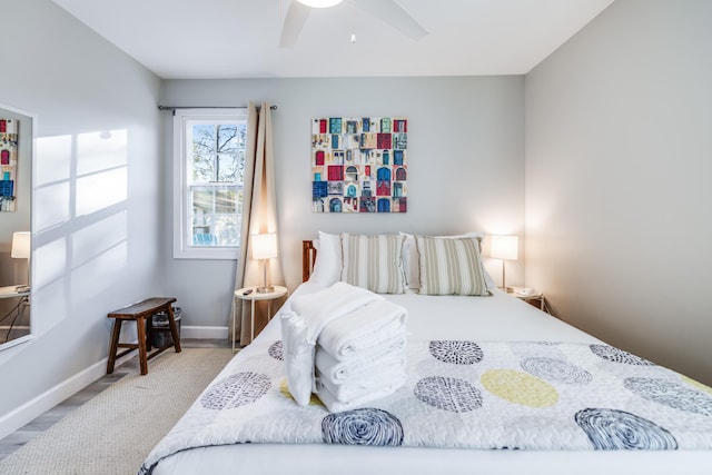 bedroom featuring ceiling fan and baseboards