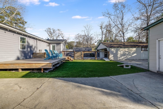 view of yard featuring a patio area, fence, and a deck