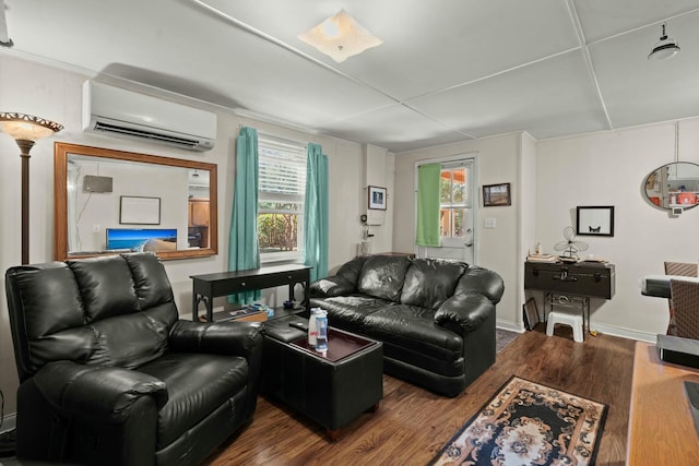 living area featuring an AC wall unit and wood finished floors