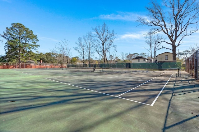 view of sport court with fence