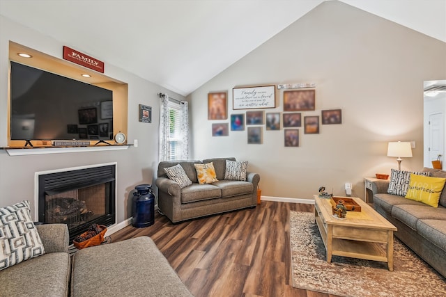 living room featuring a fireplace, recessed lighting, baseboards, wood finished floors, and vaulted ceiling