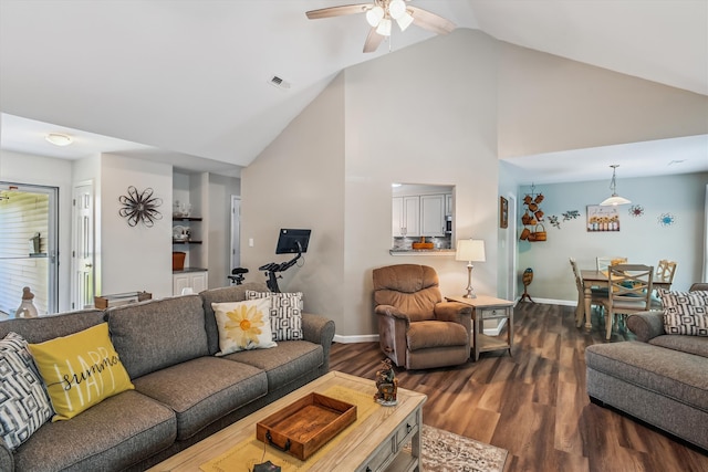 living area featuring a ceiling fan, visible vents, high vaulted ceiling, baseboards, and dark wood-style floors