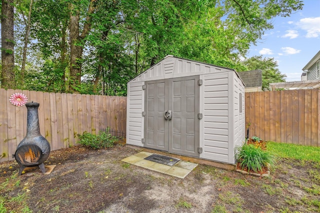 view of shed featuring a fenced backyard