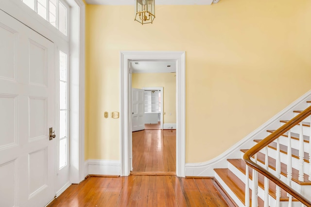 52 Hasell St, Charleston, SC 29401 - entryway with light wood-style flooring and stairs