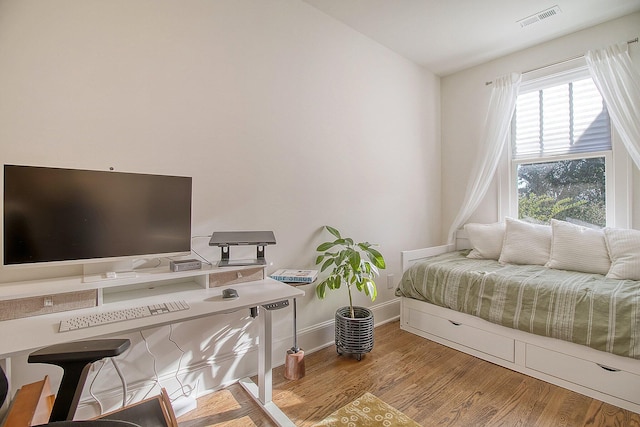 bedroom featuring light hardwood / wood-style floors