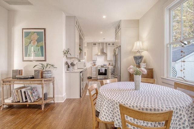 dining room featuring light hardwood / wood-style flooring