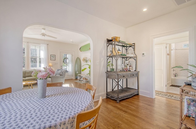 dining area featuring ceiling fan and light hardwood / wood-style flooring