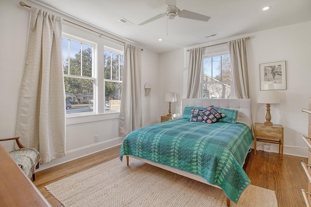 bedroom with hardwood / wood-style flooring and ceiling fan