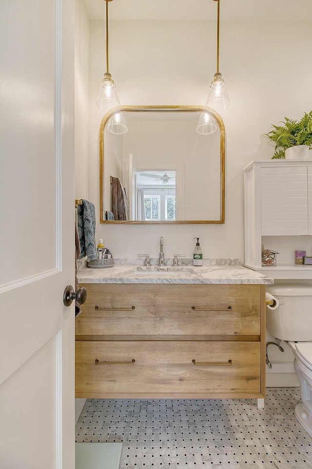 bathroom with vanity and toilet