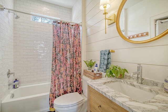 full bathroom with toilet, vanity, wooden walls, and shower / bath combo with shower curtain