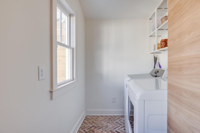 laundry area with washing machine and dryer