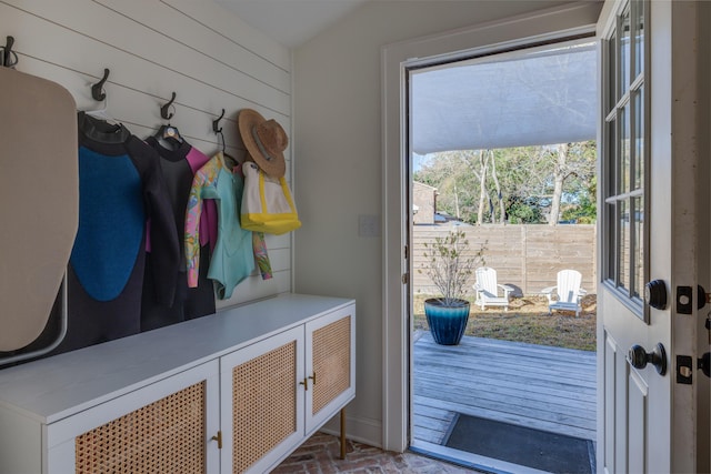 mudroom with wooden walls