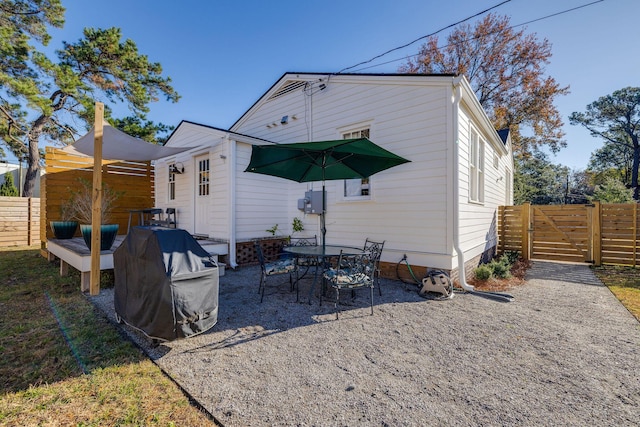 rear view of house featuring a patio