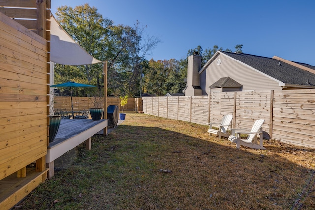 view of yard featuring a wooden deck