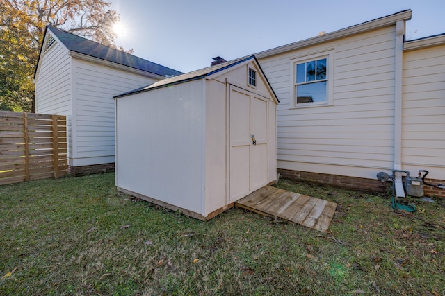 view of outbuilding with a yard