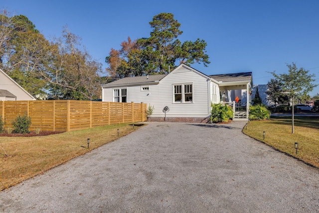 view of front of home with a porch and a front lawn