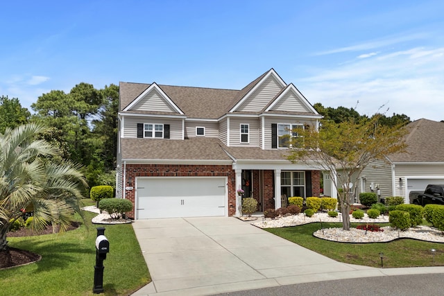 craftsman-style home with brick siding, driveway, a shingled roof, and a front lawn