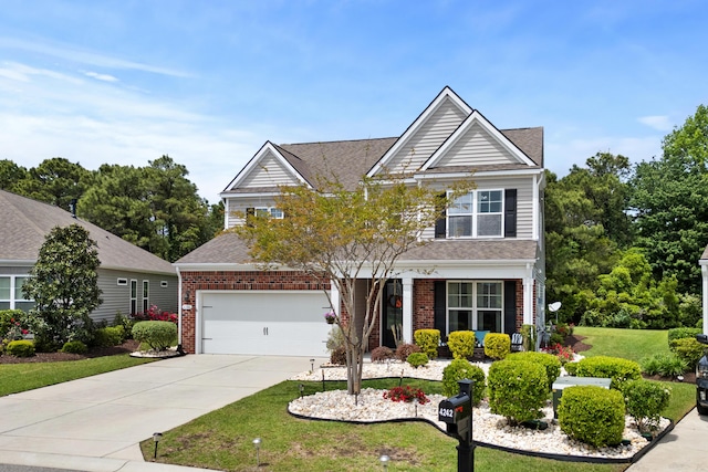 view of front of home with concrete driveway, brick siding, a shingled roof, and a front yard