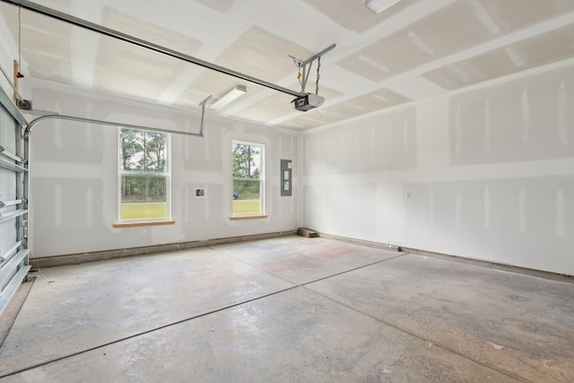 garage with electric panel and a garage door opener