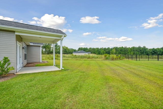 view of yard featuring a patio area and fence