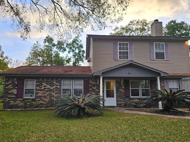 front of property with a lawn