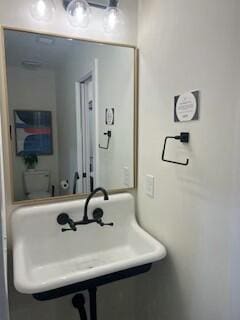 bathroom with sink and toilet