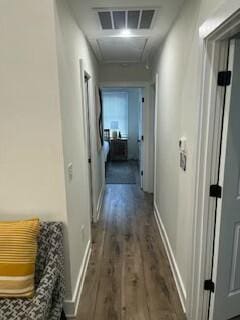 hallway with dark wood-type flooring