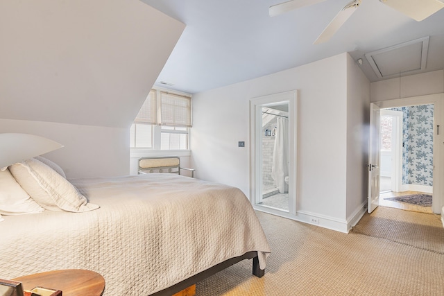 carpeted bedroom featuring visible vents, attic access, a ceiling fan, connected bathroom, and baseboards