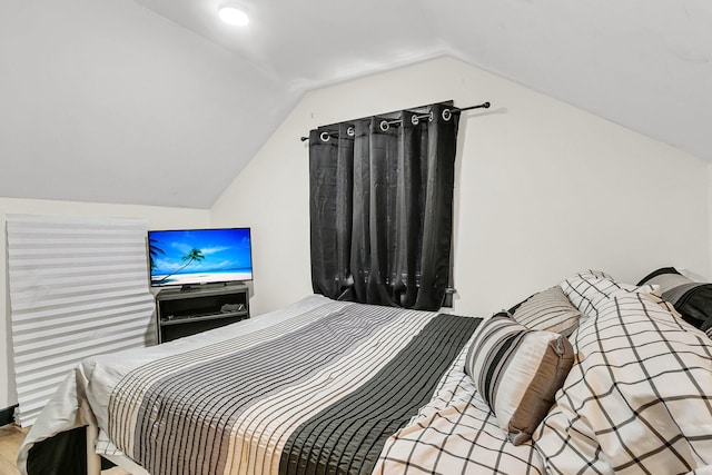 bedroom with lofted ceiling