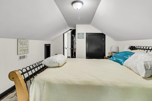 bedroom with vaulted ceiling