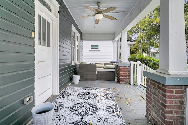 view of patio with ceiling fan and a porch