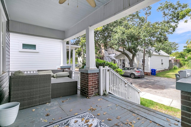 view of patio / terrace with ceiling fan and a porch