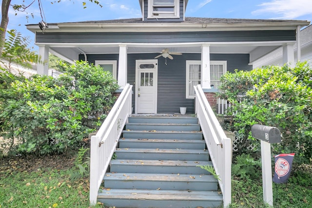 doorway to property with ceiling fan