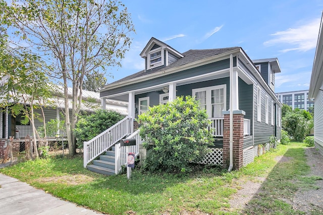 view of front of property featuring covered porch