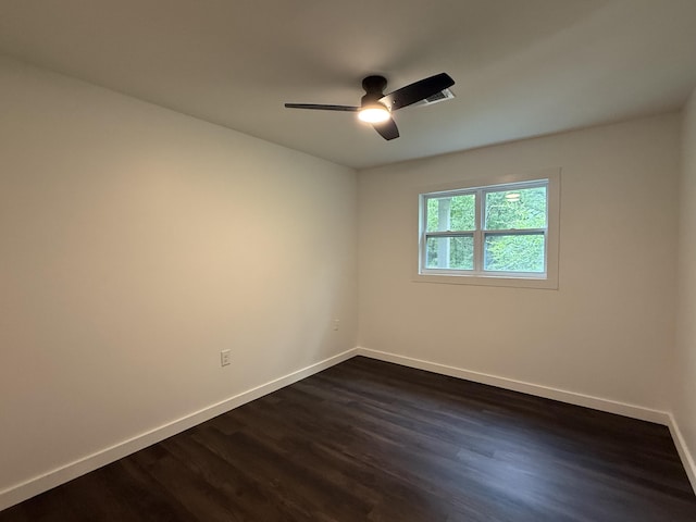 208 Orange St, Walterboro, SC 29488 - spare room featuring baseboards, dark wood-type flooring, and a ceiling fan