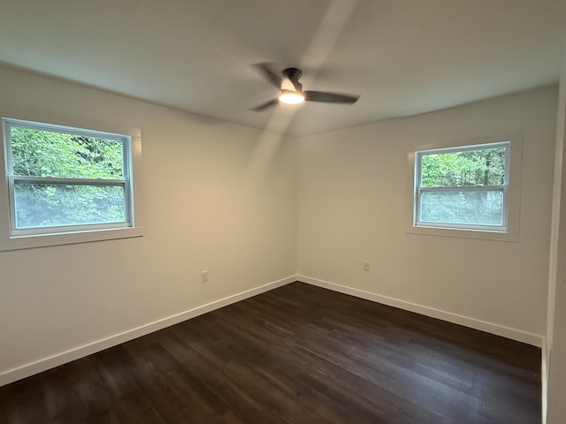 208 Orange St, Walterboro, SC 29488 - spare room featuring healthy amount of natural light, dark wood-style flooring, a ceiling fan, and baseboards