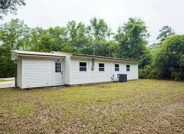 208 Orange St, Walterboro, SC 29488 - back of house featuring a yard and central AC unit