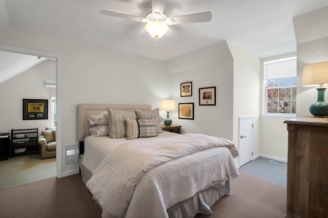 carpeted bedroom with ceiling fan and baseboards