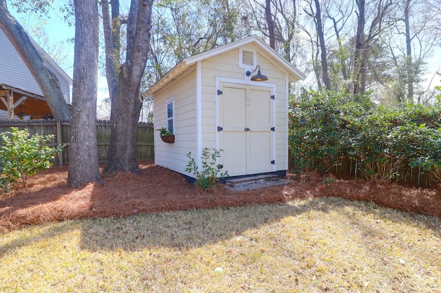 view of shed with fence