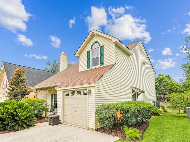 exterior space featuring a front lawn and a garage