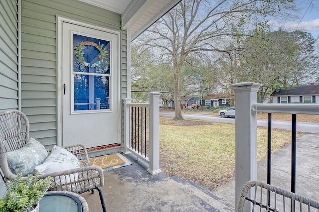 doorway to property featuring a yard