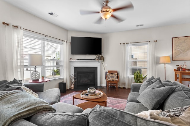 1821 Towne St, Johns Island, SC 29455 - living area featuring plenty of natural light, a ceiling fan, wood finished floors, and a fireplace with flush hearth