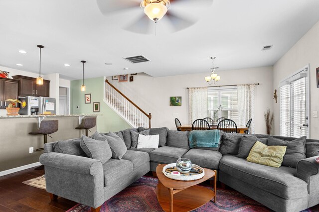 1821 Towne St, Johns Island, SC 29455 - living area with stairs, dark wood-style flooring, recessed lighting, ceiling fan, and a chandelier
