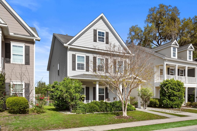 1821 Towne St, Johns Island, SC 29455 - view of front of house with a front yard and covered porch