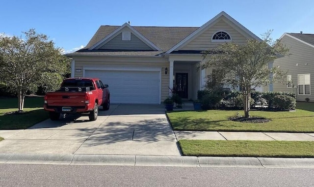 ranch-style home with a garage and a front yard