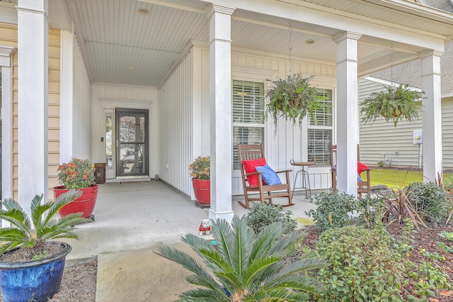 view of exterior entry with covered porch